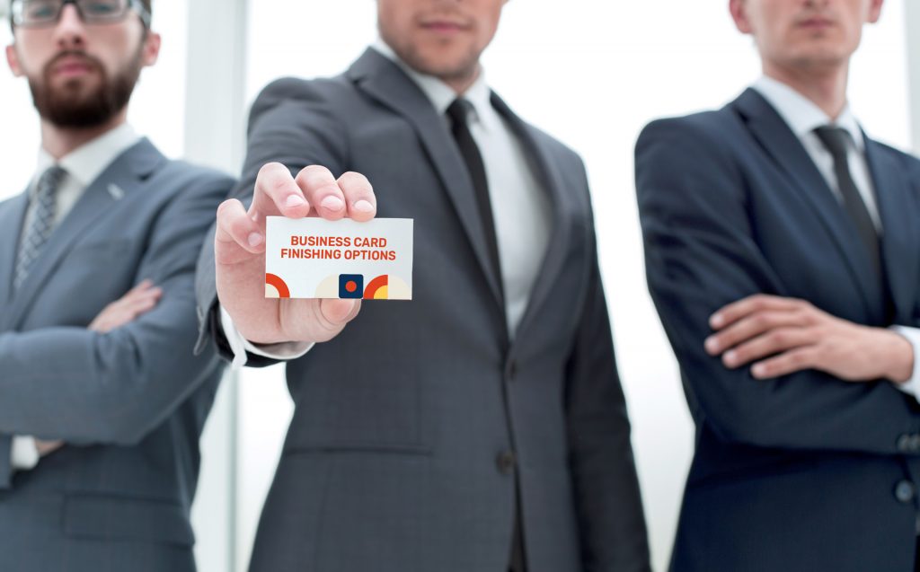 business-team-leader-showing-business-card