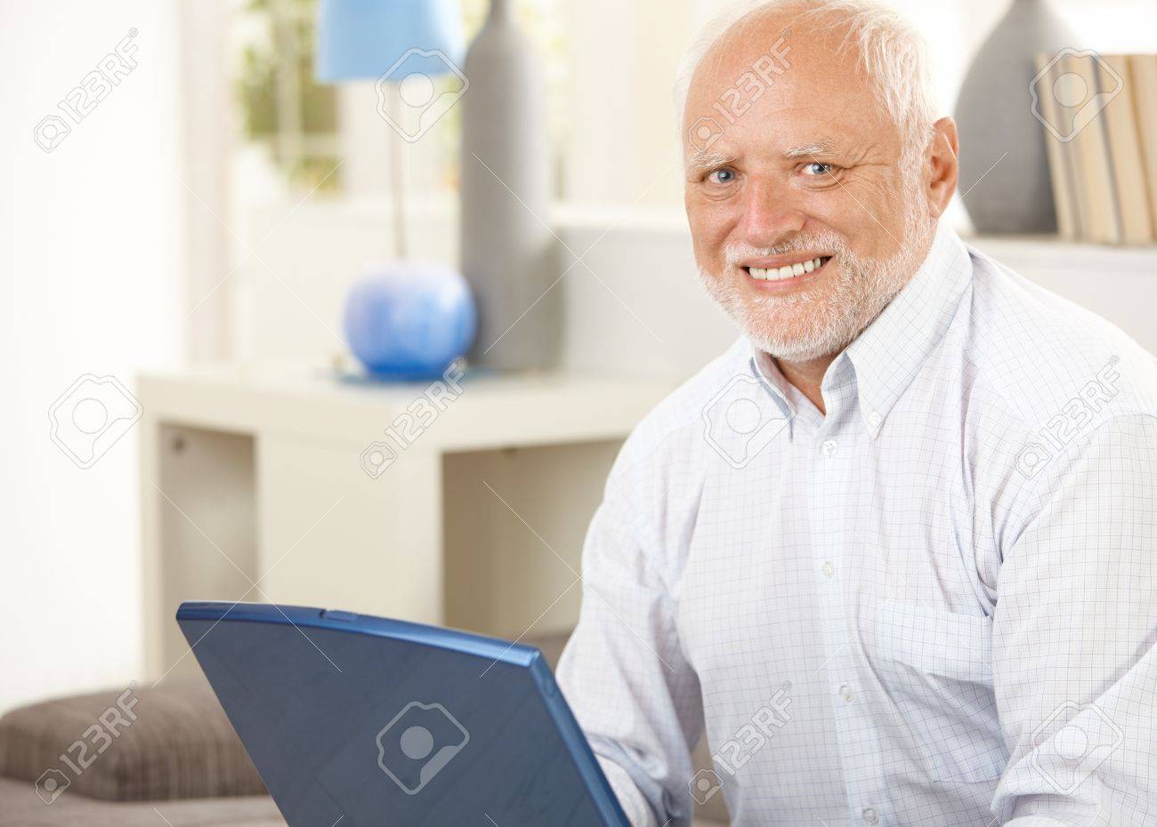 Stock image of man smiling painfully with watermark still on it