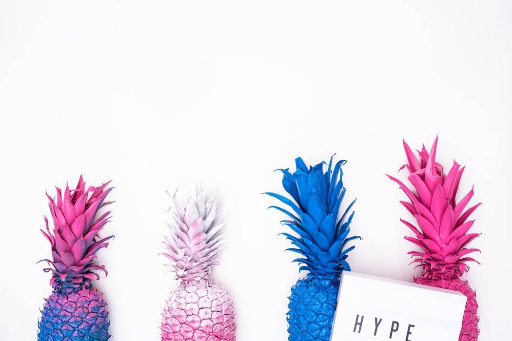 Colourful pneaplles with the word "Hype" above them